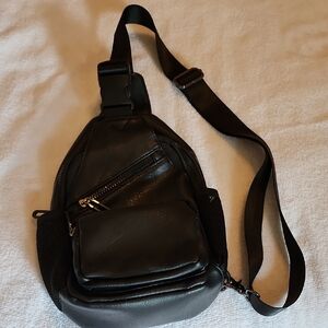 Black Backpack with Adjustable Strap and Minimalist Design